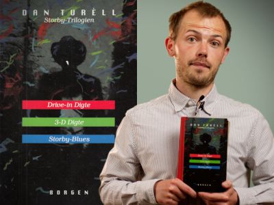 Bibliotekets litteraturformidler Stinus holder bogen "Storby-Trilogien"